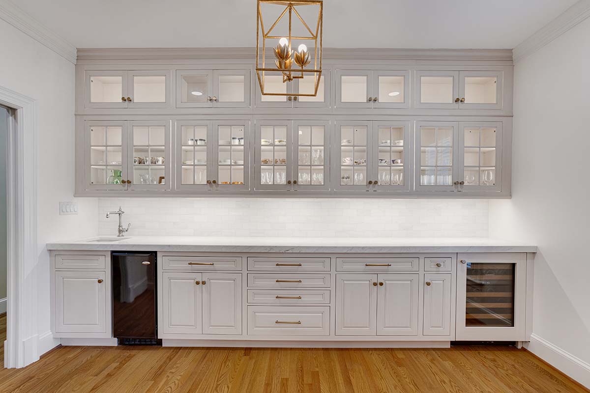 Luxury Spacious Wet Bar With White Cabinets